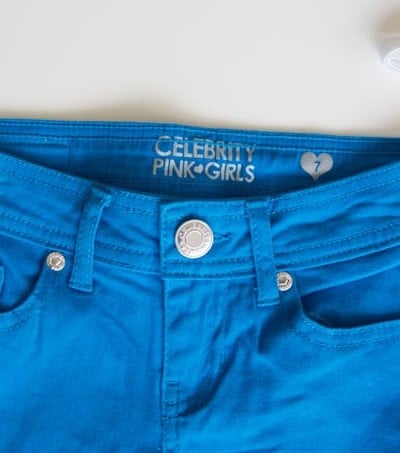 Add an adjustable elastic waistband to kids' clothes in a snap. No sewing machine necessary! It's so simple to turn unusable shorts/pants into a perfectly fitting pair!
