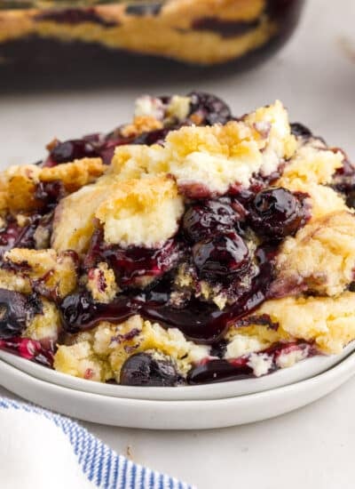 A serving of Blueberry Dump Cake on a dish.