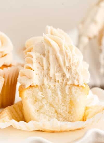 Brown Butter Frosting on a cupcake with a bite taken from it.