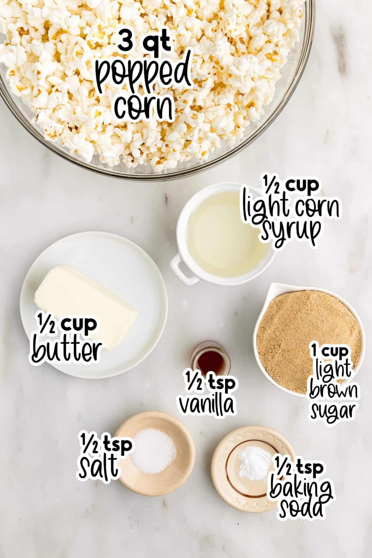 Bowl of popped corn and dishes of other individual ingredients needed to make caramel corn, with text labels.