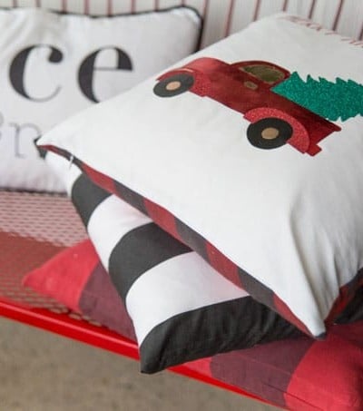 Create these festive and beautiful Christmas pillows with custom iron-on designs.