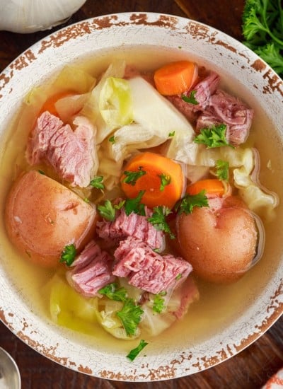 Top view of corned beef and cabbage soup in a bowl.