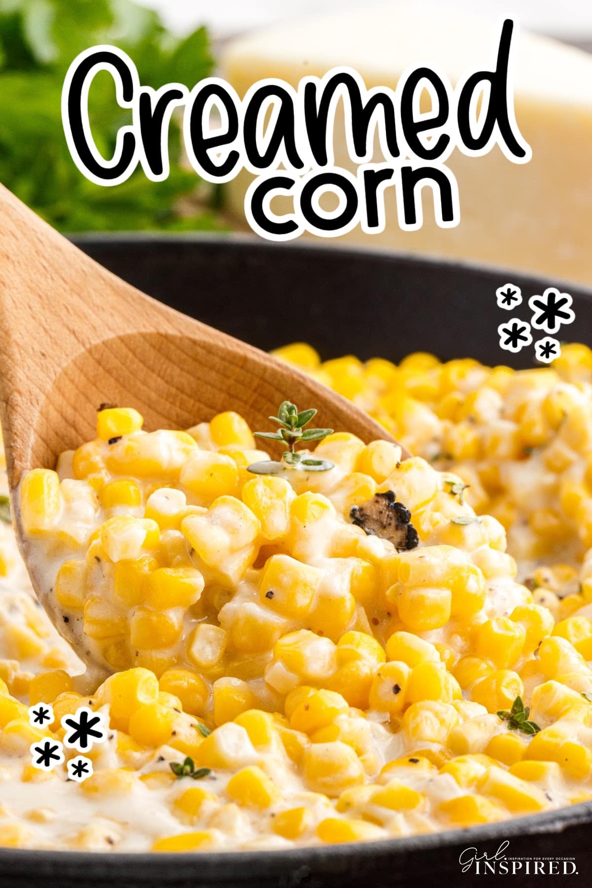 Old Fashioned Creamed Corn in a skillet scooped up with a wooden spoon with text overlay.
