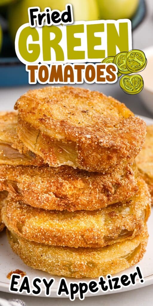 Stack of fried green tomatoes on a platter, being served with a fork, and a bowl of green tomatoes in the background.