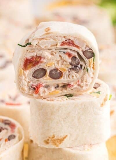 Stack of Mexican Pinwheels on a cutting board.