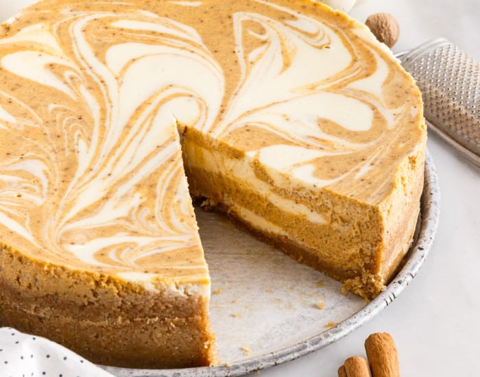 slice missing from pumpkin swirl cheesecake