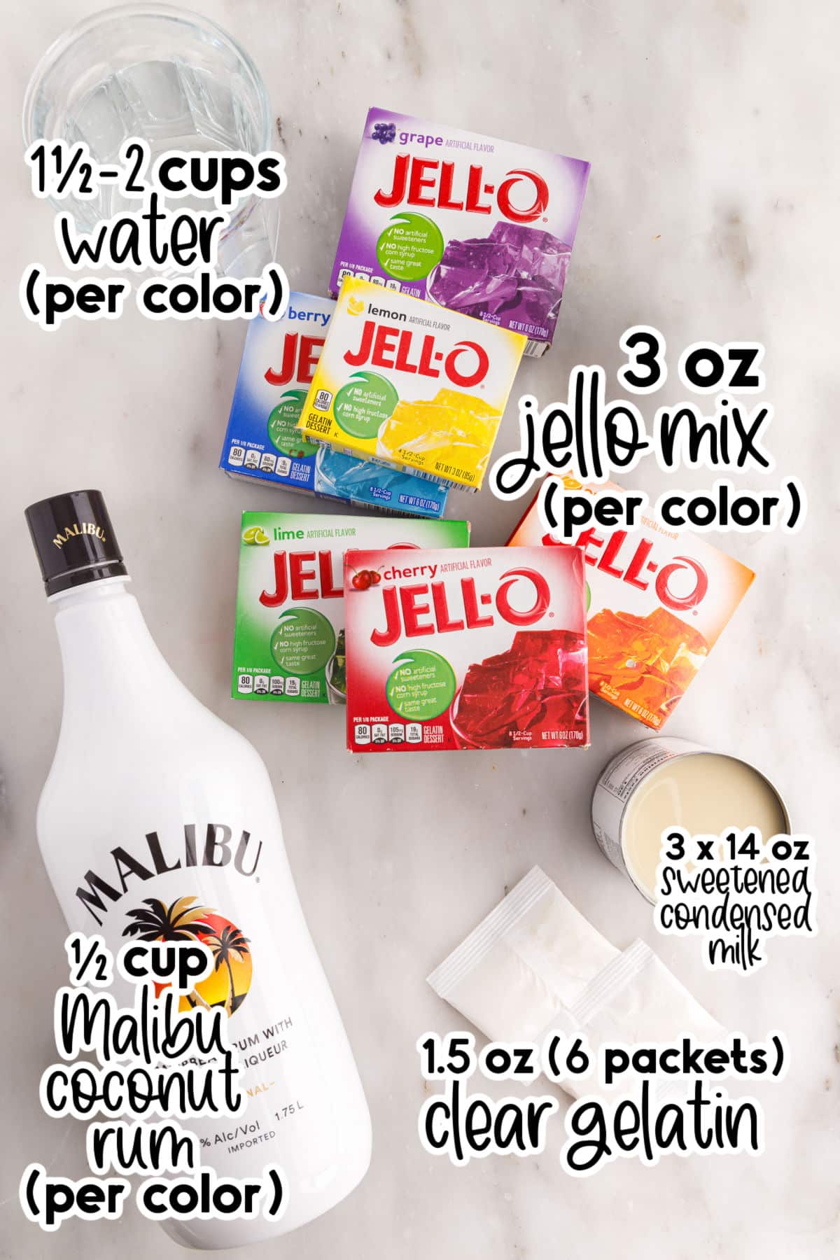 Ingredients to make rainbow Jello shots on a marble coutertop.