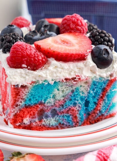 A slice of Red White and Blue Marble Cake on a dish.