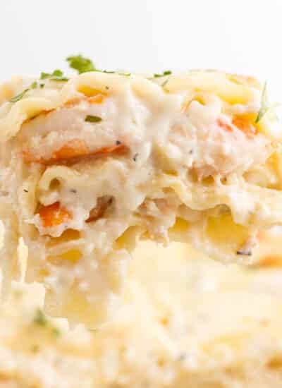 Close up of a slice of Shrimp Lasagna on a spatula.