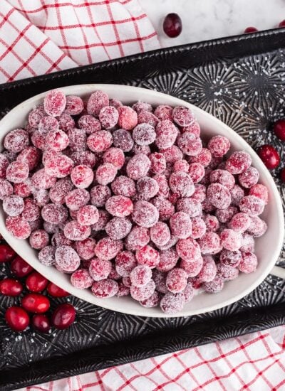 Bowl of Sugared Cranberries, on a baking sheet.