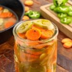 Close up of a jar of Pickled Jalapeños and Carrots.