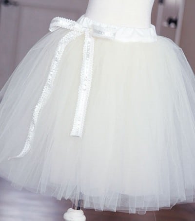 White tutu with white ribbon on dress form